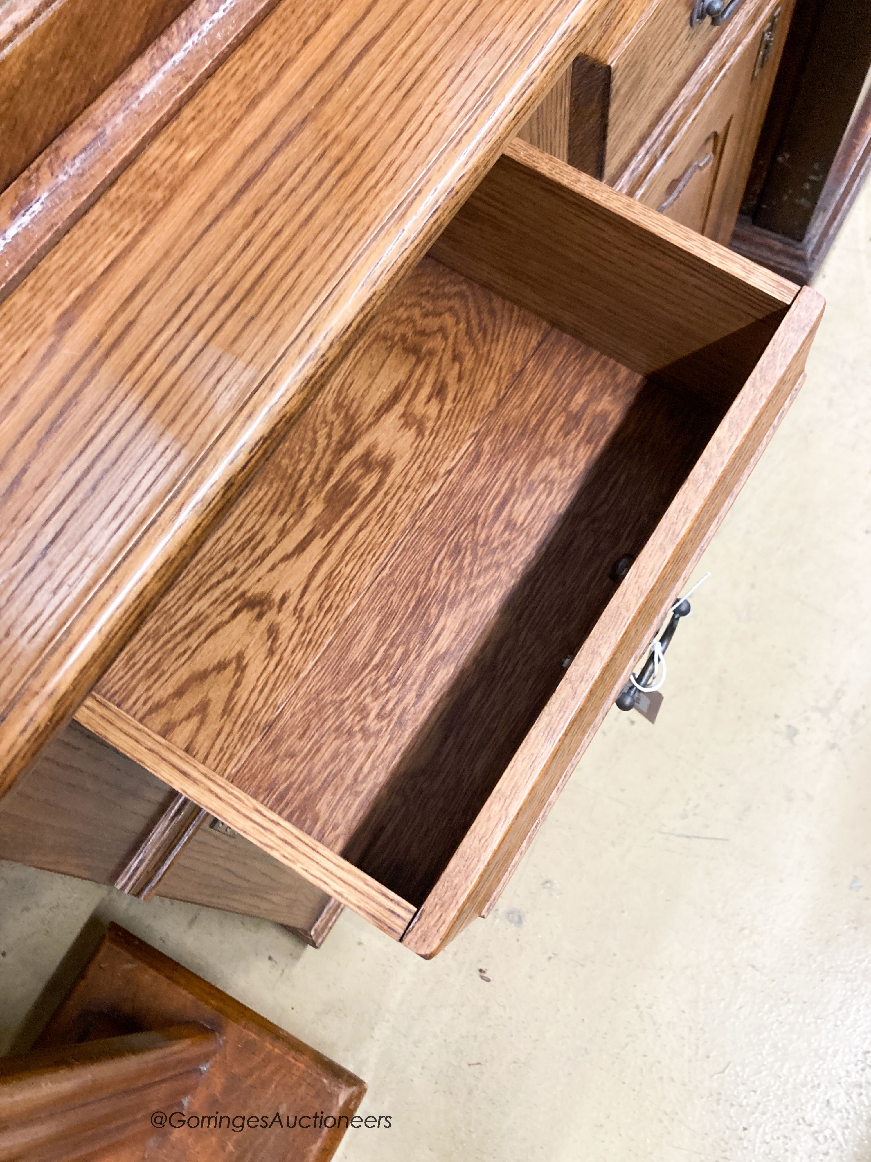 A reproduction oak bookcase cupboard, width 97cm, depth 43cm, height 190cm
